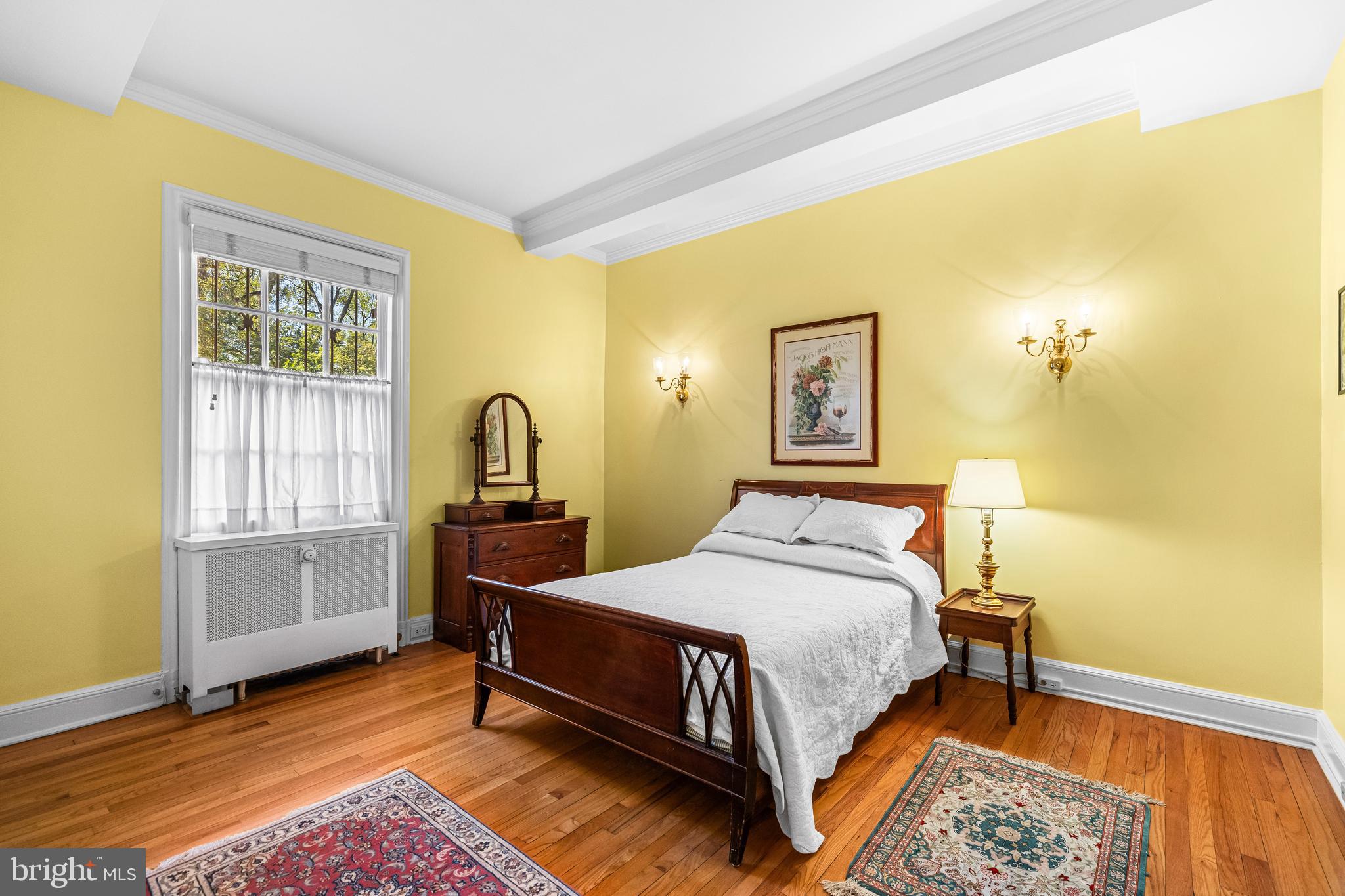 6 Upland Road, Unit F1 Baltimore, MD 21210 - Photo 31 of 50 a bedroom with a bed and wooden floor