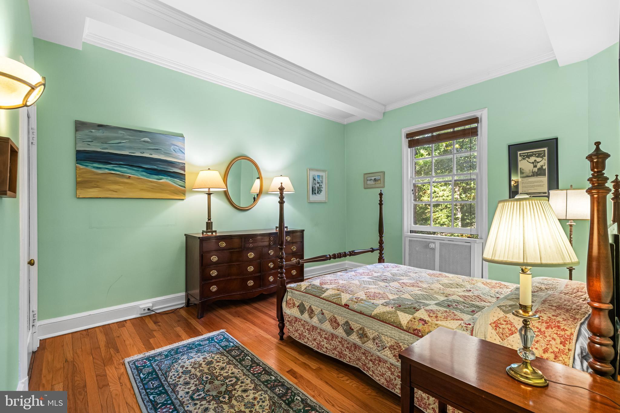 6 Upland Road, Unit F1 Baltimore, MD 21210 - Photo 33 of 50 a bedroom with a bed dresser and a window