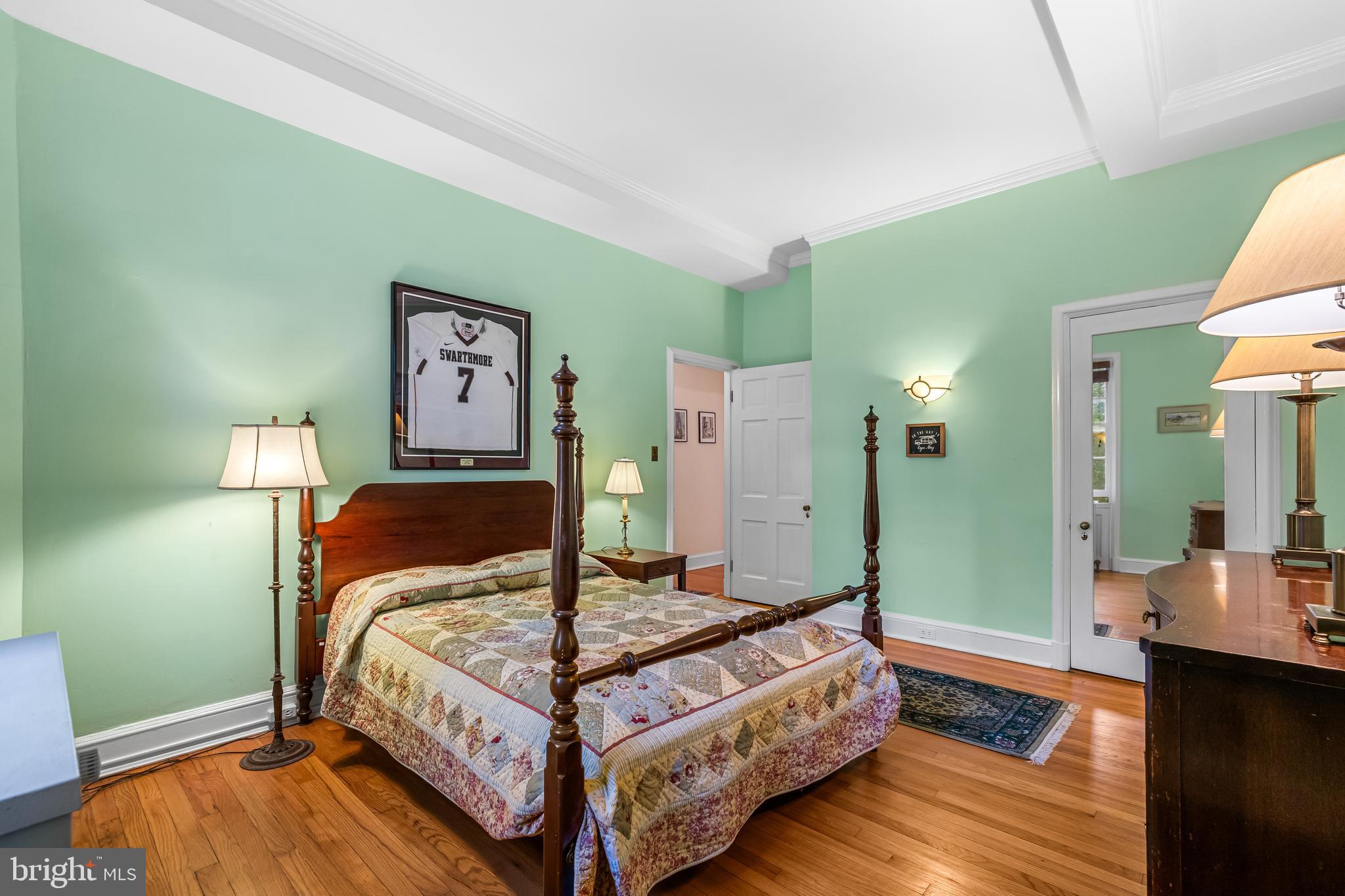 6 Upland Road, Unit F1 Baltimore, MD 21210 - Photo 35 of 50 a bedroom with a bed and a table