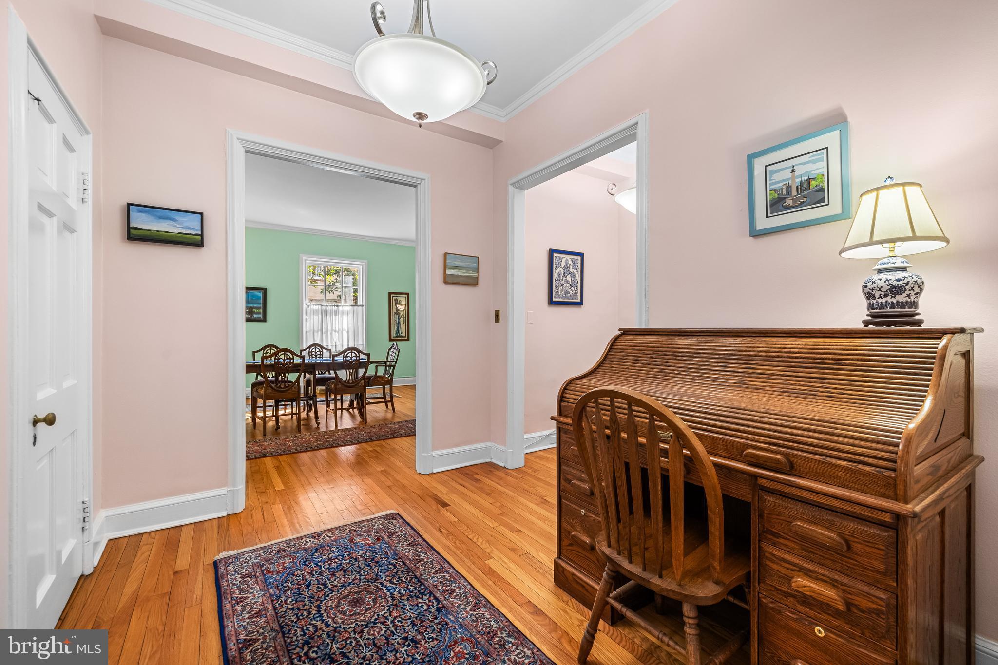 6 Upland Road, Unit F1 Baltimore, MD 21210 - Photo 6 of 50 a bedroom with furniture and wooden floor