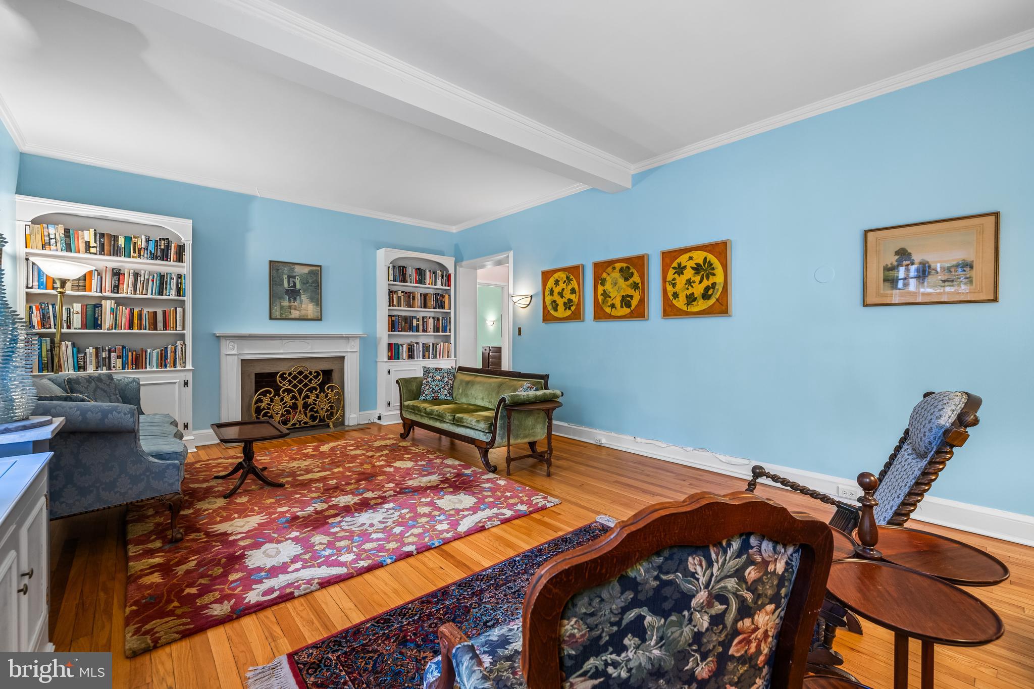 6 Upland Road, Unit F1 Baltimore, MD 21210 - Photo 8 of 50 a bedroom with a bed a chair and a fireplace