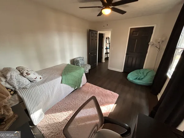 a living room with furniture rug and a window