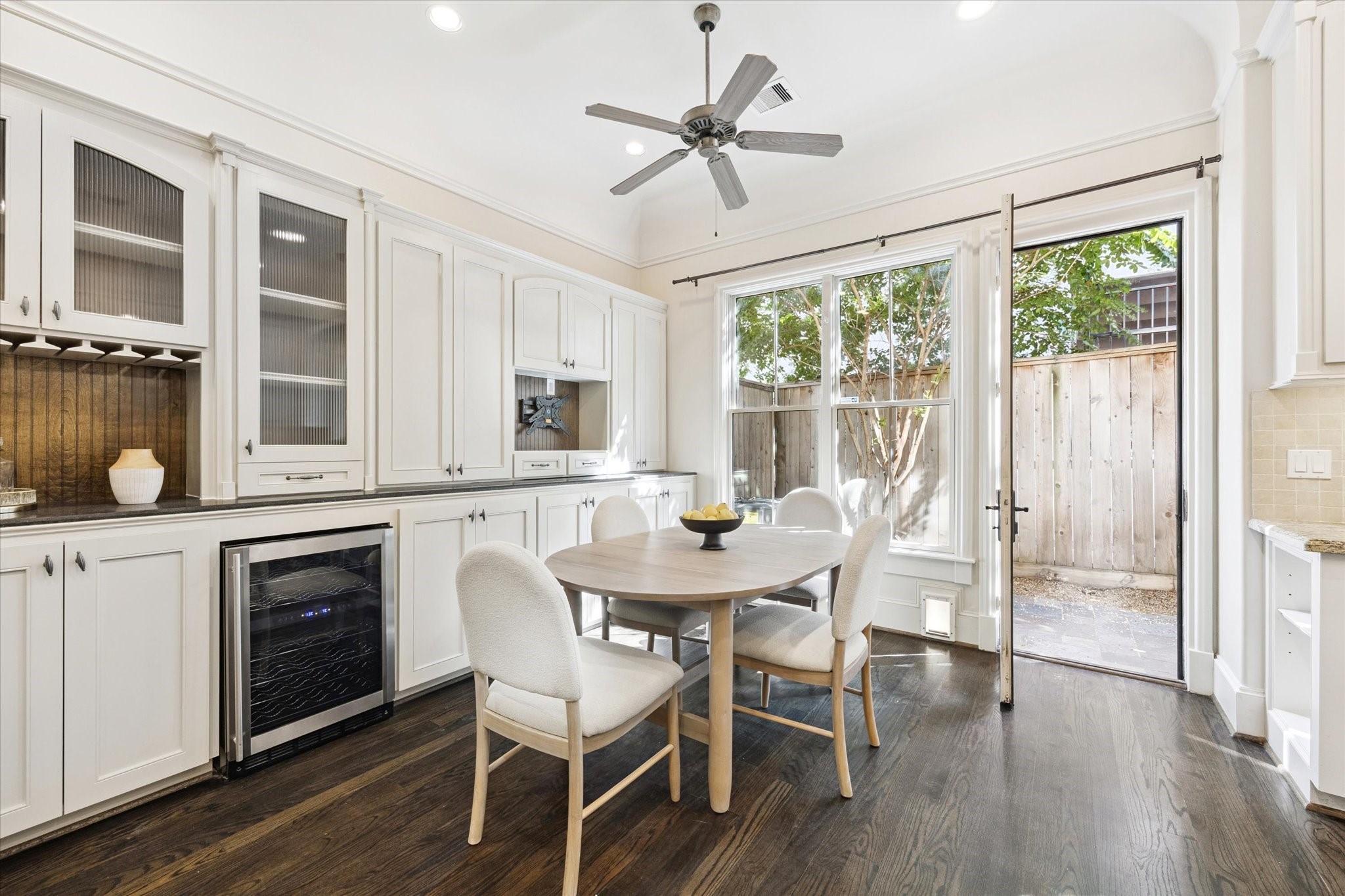 2145 Fairview Street Houston, TX 77019 - Photo 17 of 50 Tons of built-ins, storage - wine fridge and room for a small TV....LOVELY view to the back courtyard!