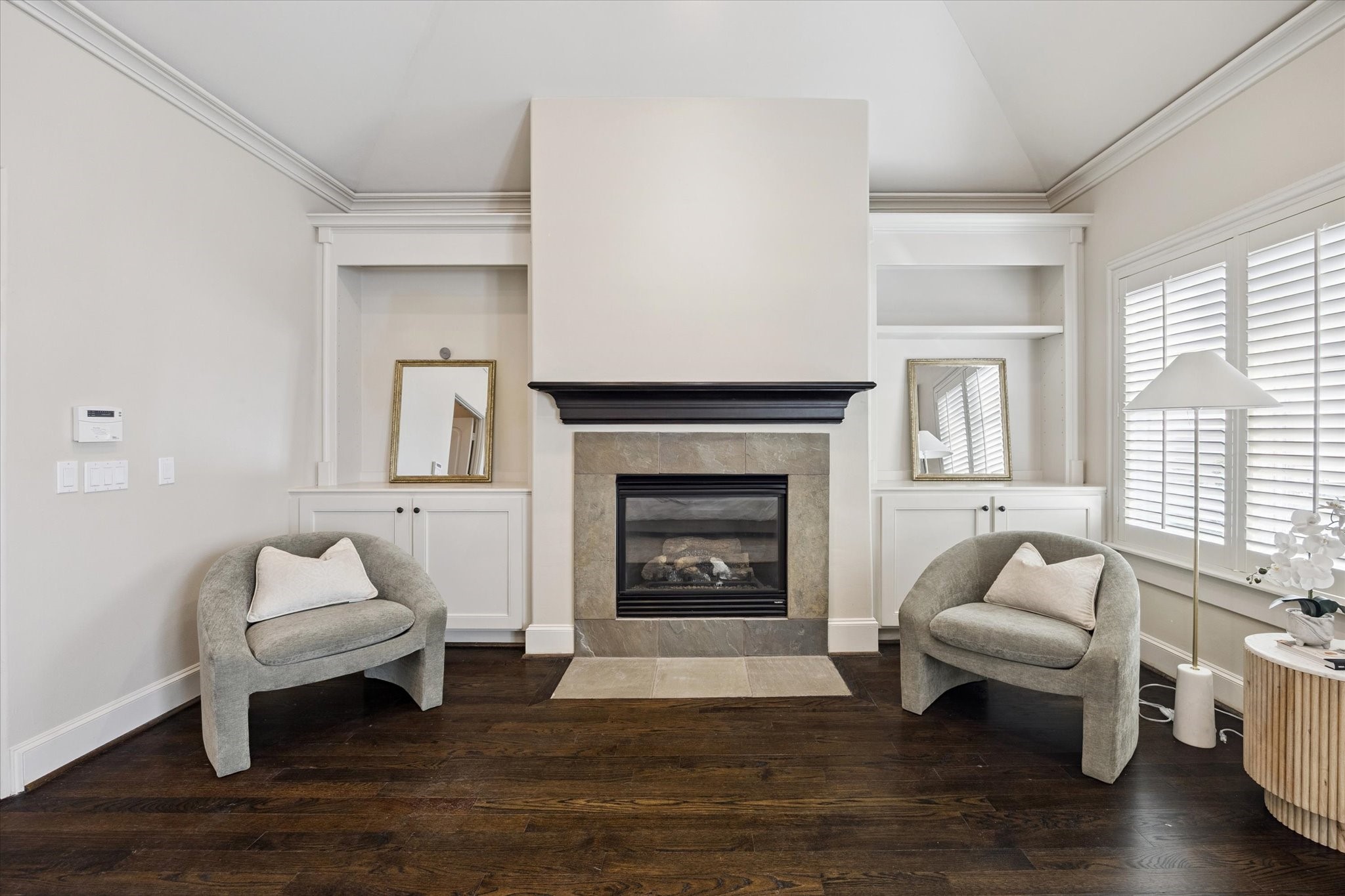 2145 Fairview Street Houston, TX 77019 - Photo 32 of 50 Primary Suite - cozy sitting area with s log fireplace and built-ins!