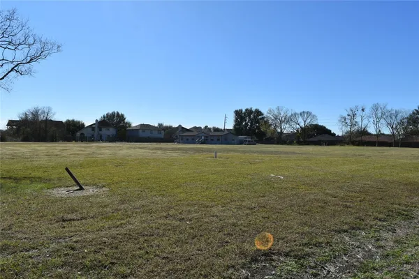 a view of a lake with a yard
