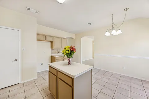 a view of a livingroom with a ceiling fan and window