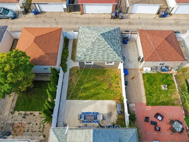 swimming pool view with a garden and plants