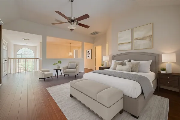 a bedroom with bed and a large window