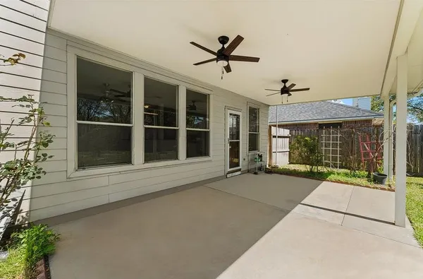 a view of a flesh screen tv and wooden floor