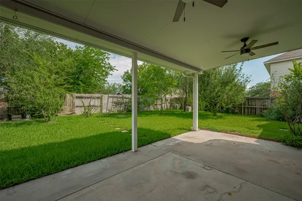 a view of a yard with porch and garden