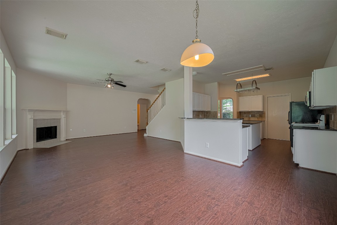 619 Bending Bough Drive Spring, TX 77388 - Photo 8 of 41 a view of a kitchen with a sink a fireplace and a window