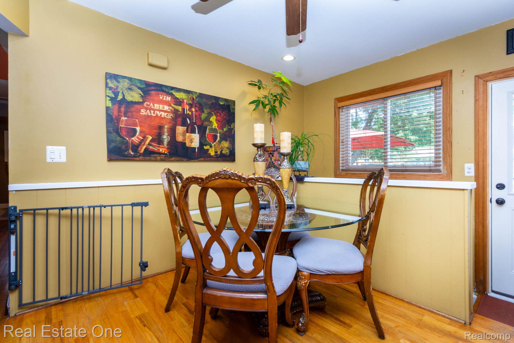 220 Winry Drive Rochester, MI 48307 - Photo 14 of 35 Dining area featuring hardwood flooring and a ceiling fan