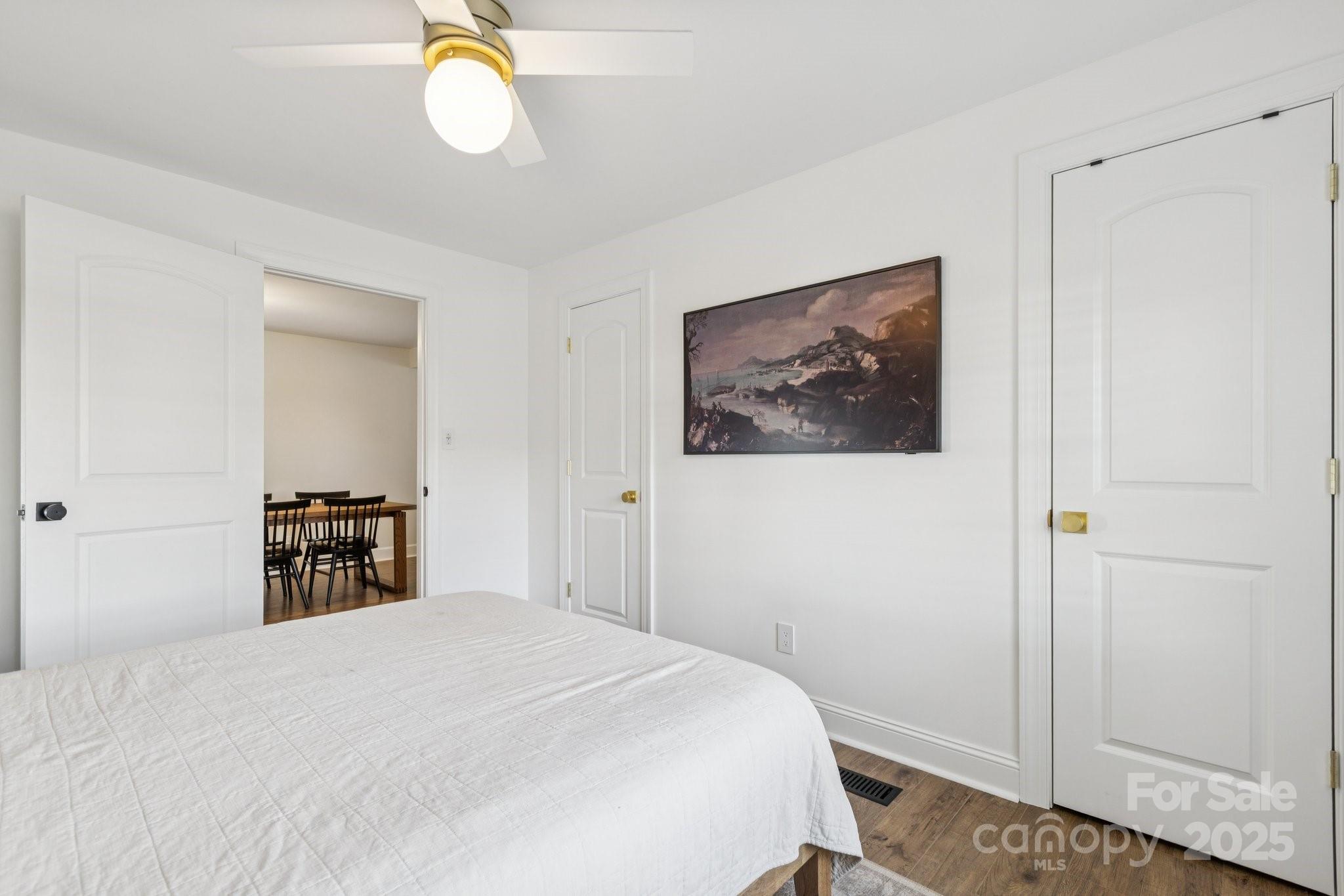 1225 Liberty Road Chester, SC 29706 - Photo 15 of 37 a bedroom with a bed and a chandelier