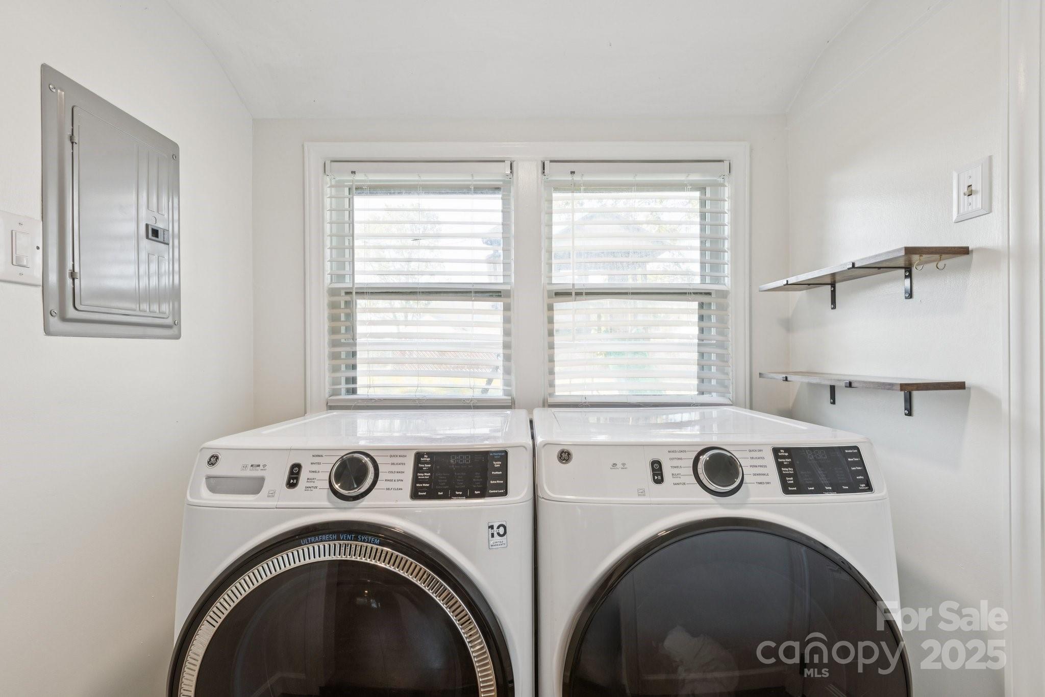 1225 Liberty Road Chester, SC 29706 - Photo 22 of 37 a view of washer and dryer with kitchen in the background
