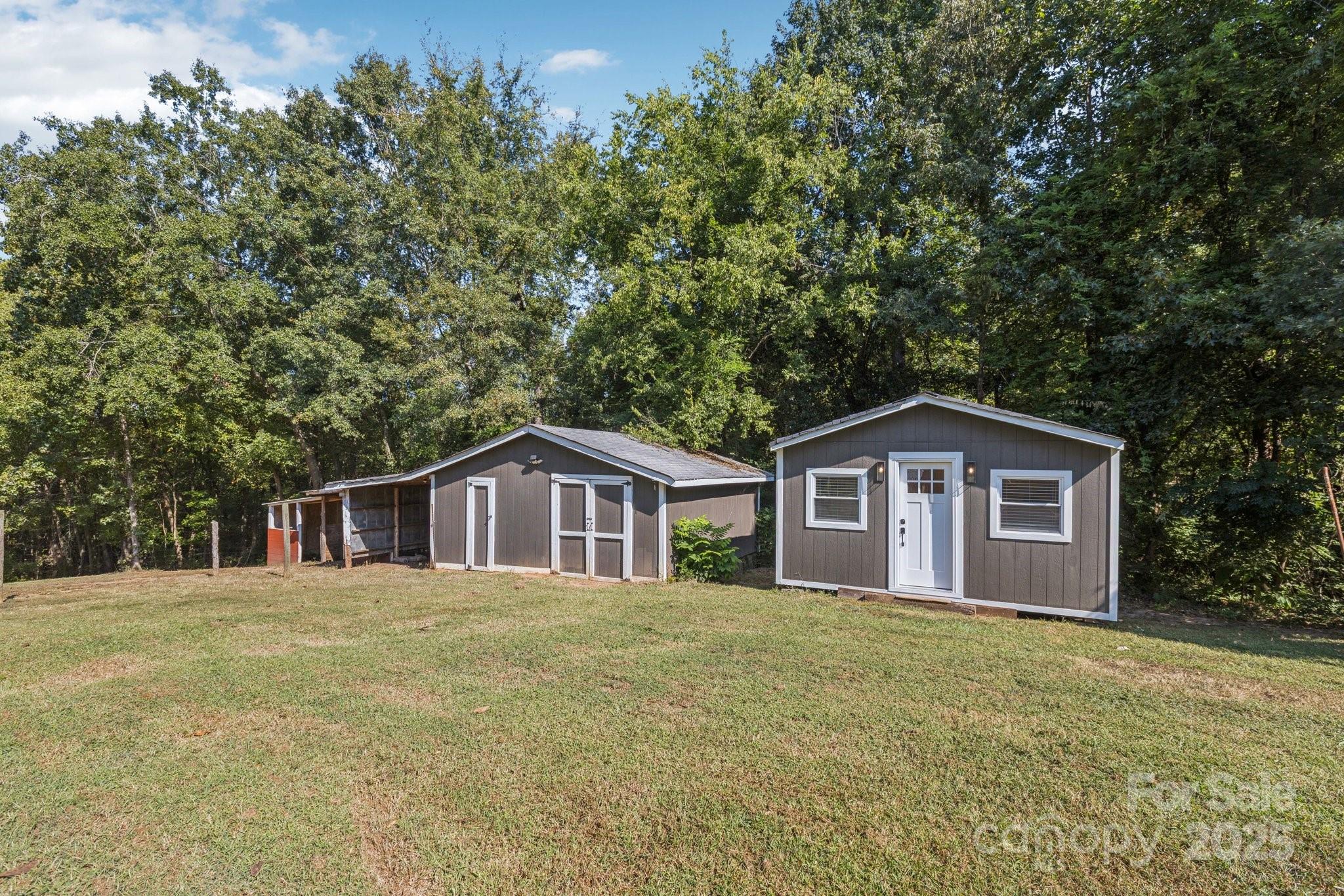 1225 Liberty Road Chester, SC 29706 - Photo 23 of 37 a view of a house with a yard and large trees