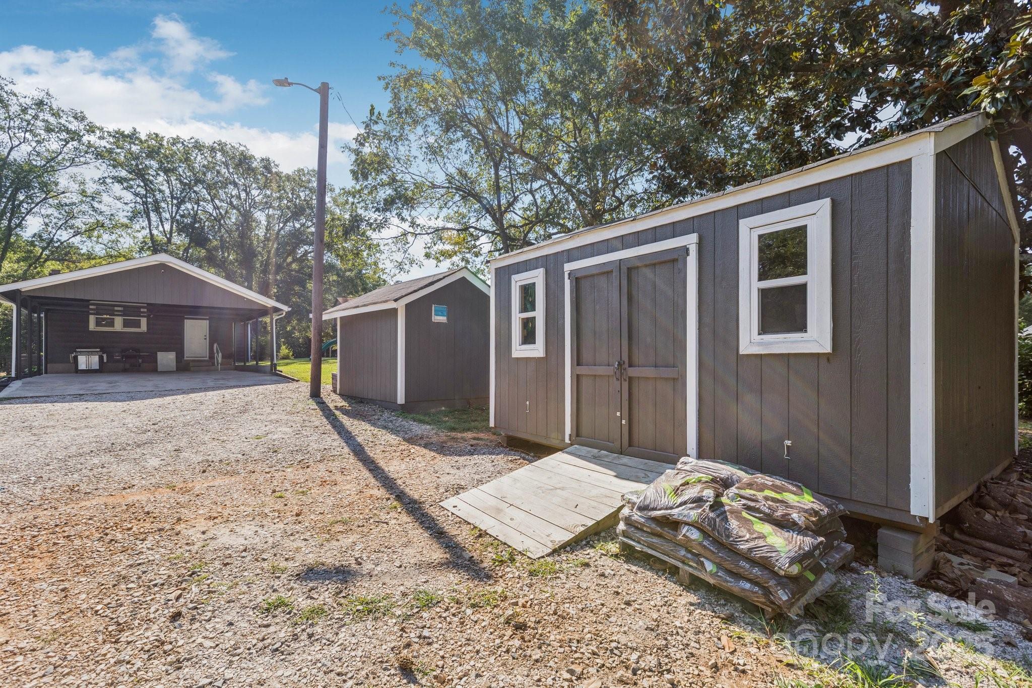 1225 Liberty Road Chester, SC 29706 - Photo 24 of 37 a front view of a house with a yard and garage