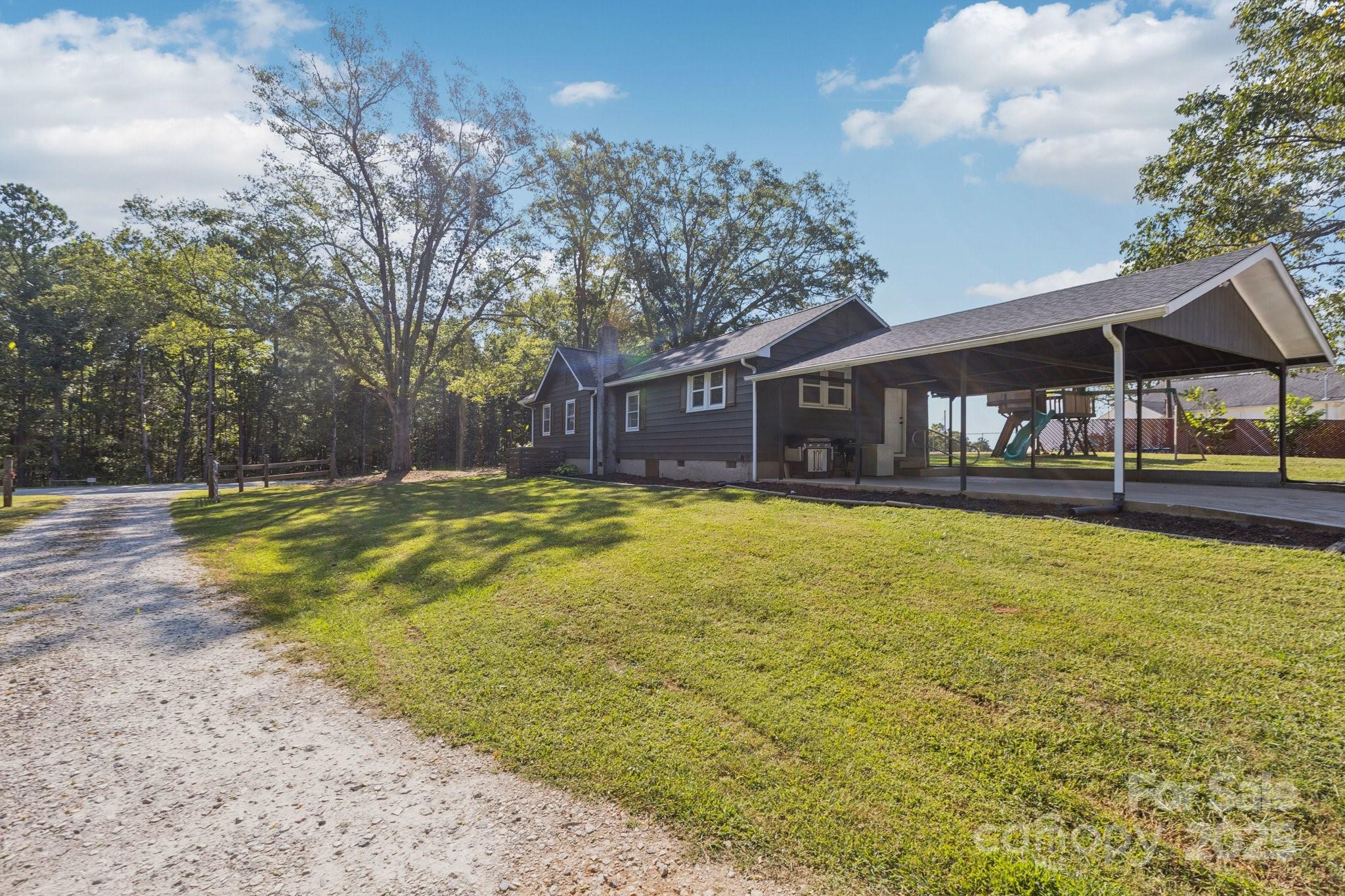 1225 Liberty Road Chester, SC 29706 - Photo 29 of 37 a swimming pool covered with buildings in the background