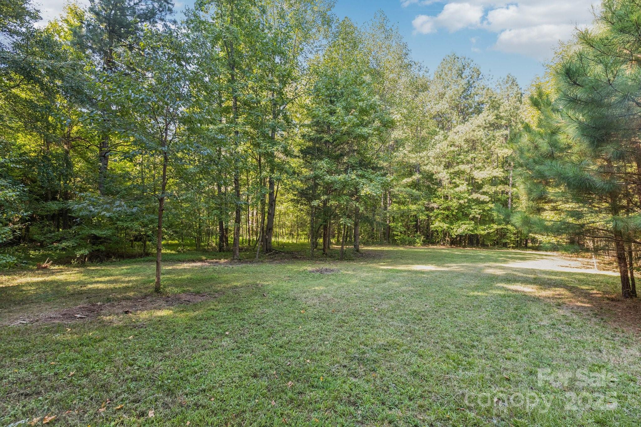 1225 Liberty Road Chester, SC 29706 - Photo 33 of 37 a view of a field with trees in the background