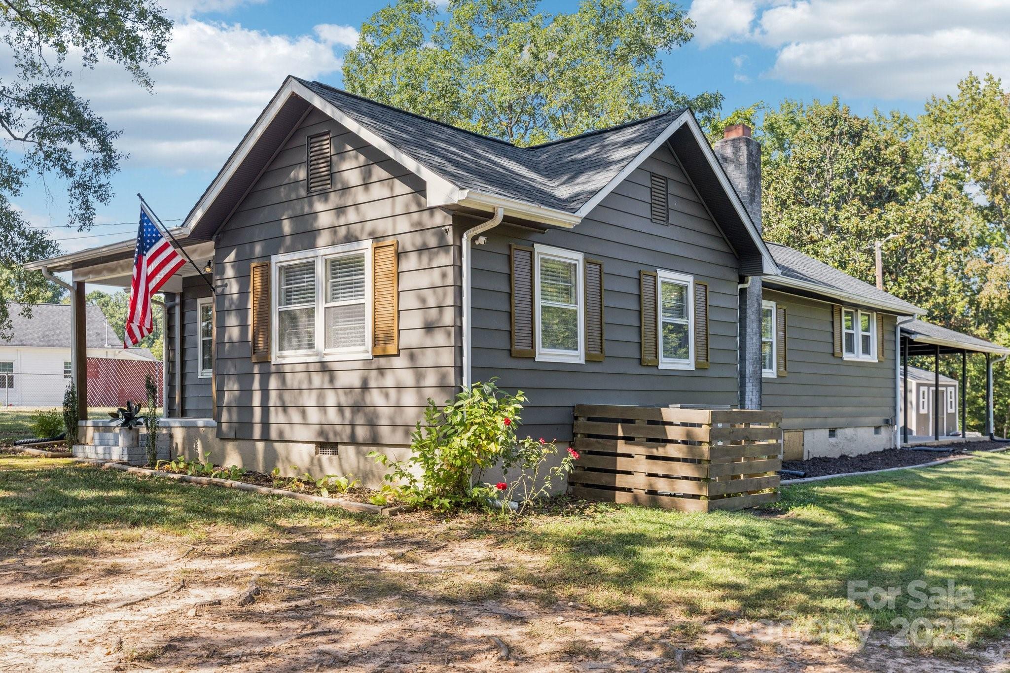 1225 Liberty Road Chester, SC 29706 - Photo 36 of 37 a view of a house with a yard
