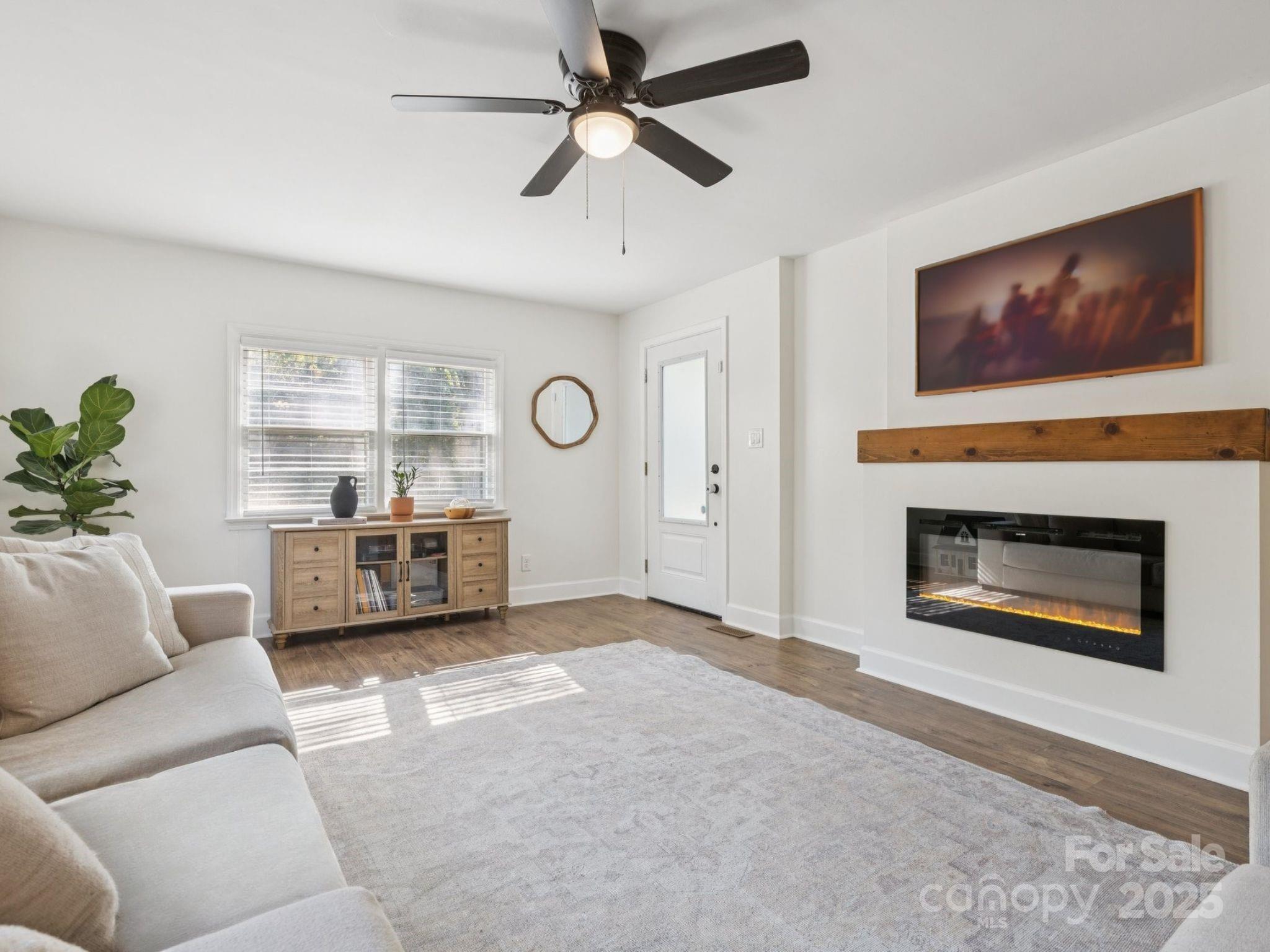 1225 Liberty Road Chester, SC 29706 - Photo 5 of 37 a living room with furniture a window and a fireplace