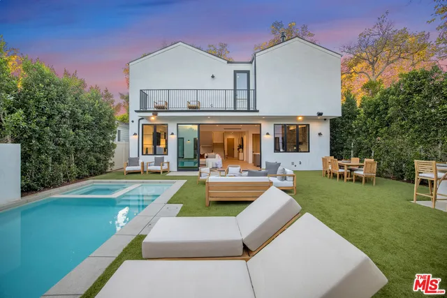 a view of a house with swimming pool yard and patio