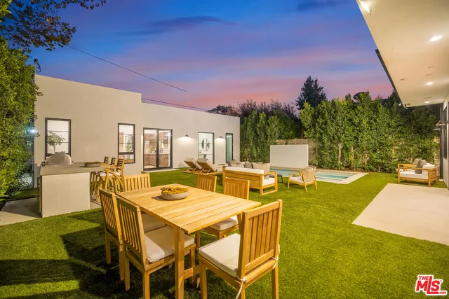 a view of a patio with swimming pool