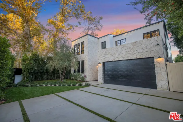 a front view of a house with yard