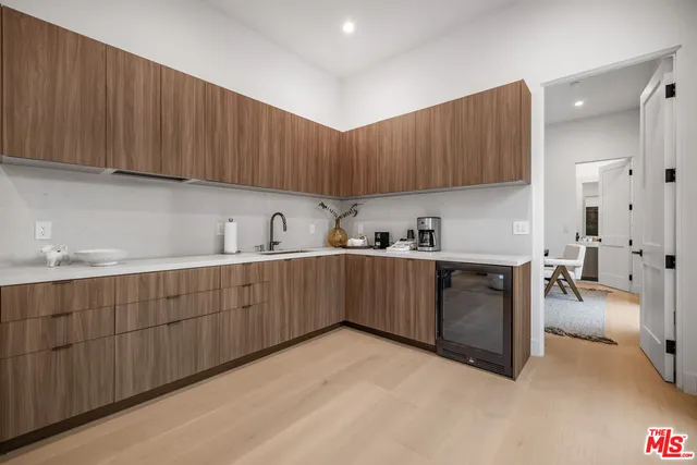 a kitchen with sink cabinets and window