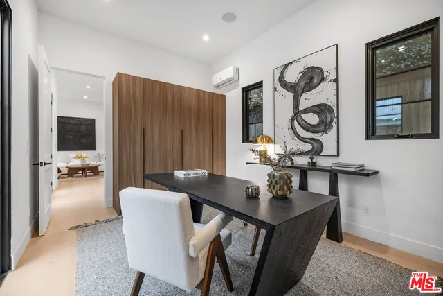 a view of a dining room with furniture and a table