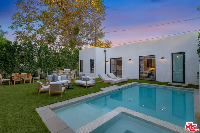 a view of a house with sitting area and furniture