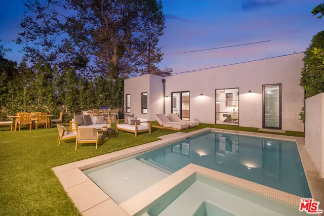 a view of a swimming pool with chairs
