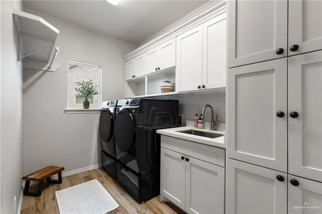 a view of cabinets a sink and a window in a kitchen