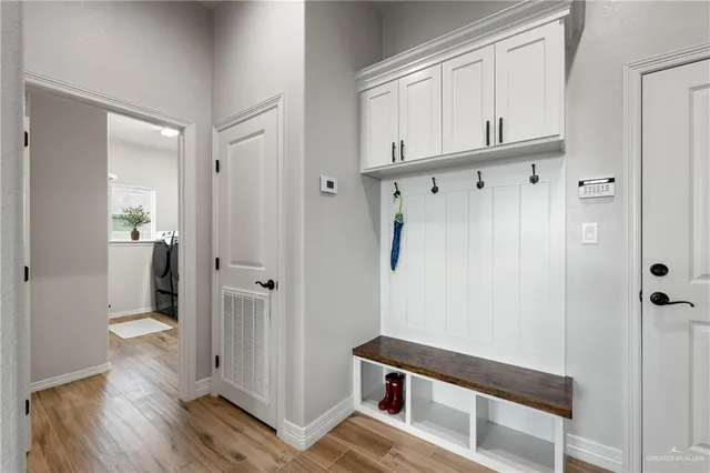 a view of a bathroom with wooden floor