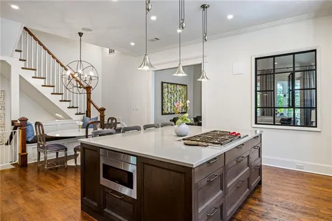 a kitchen that has a lot of cabinets in it