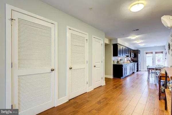 a open kitchen with stainless steel appliances granite countertop a refrigerator and a stove top oven