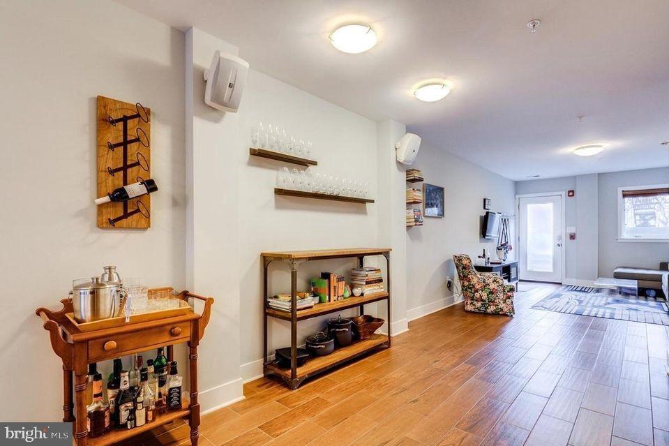 3465 14th Street Northwest, Unit A Washington, DC 20010 - Photo 17 of 28 a living room with furniture and a wooden floor
