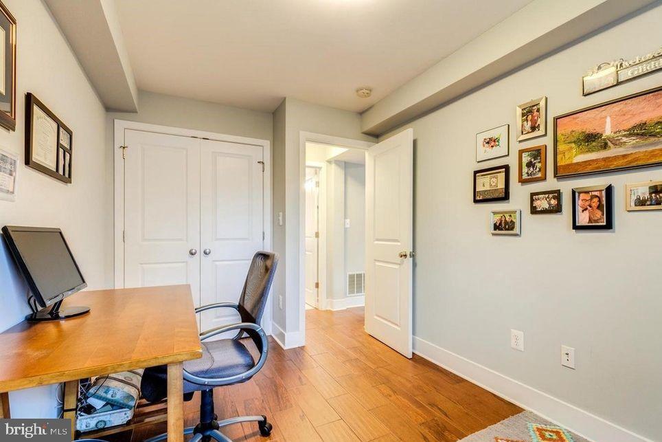 3465 14th Street Northwest, Unit A Washington, DC 20010 - Photo 25 of 28 a view of a workspace with furniture and wooden floor