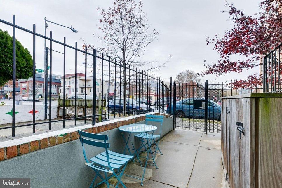 3465 14th Street Northwest, Unit A Washington, DC 20010 - Photo 5 of 28 a balcony with chairs