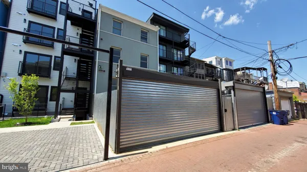 a view of a house with a street