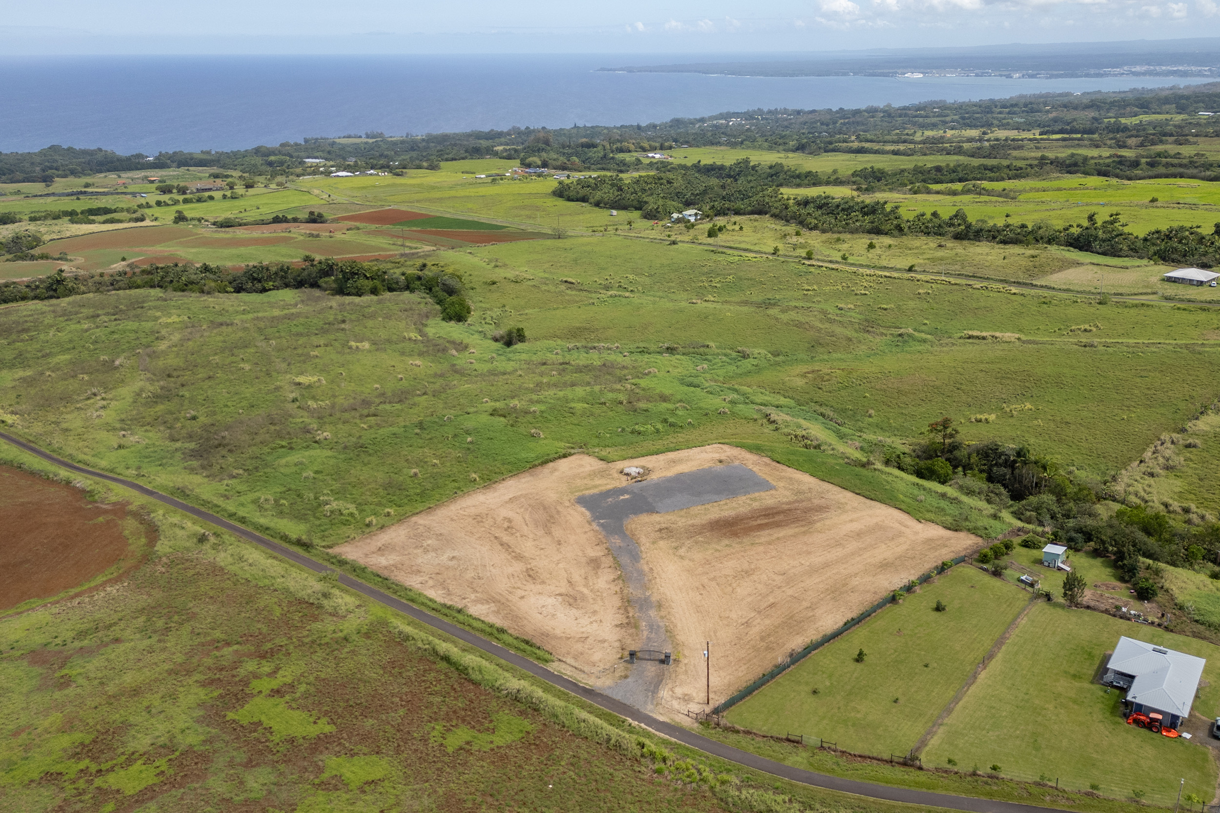 27-990 Lot 24-b-5 Onohi Loop Papaikou, HI 96781 - Photo 14 of 16 a view of a city and an ocean view