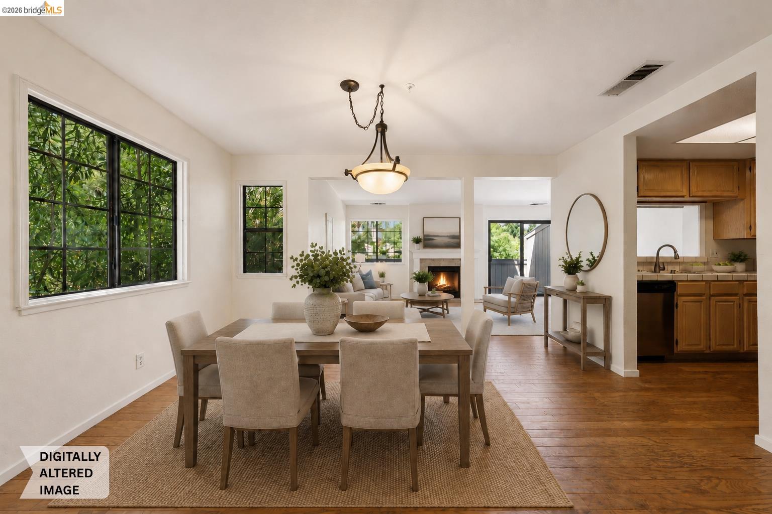 261 Redhawk Road Novato, CA 94949 - Photo 3 of 47 Dining area featuring wood-finish flooring, ample natural light through multiple windows, and an open concept layout
