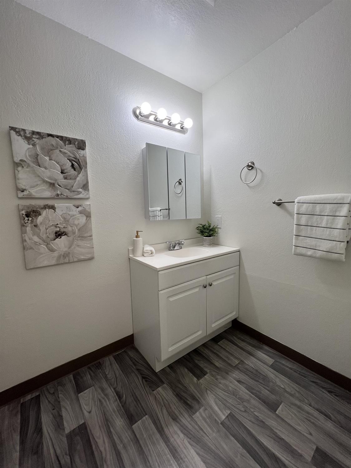 41016 Cornac Terrace Fremont, CA 94539 - Photo 12 of 24 a room with a white cabinets and wooden floor
