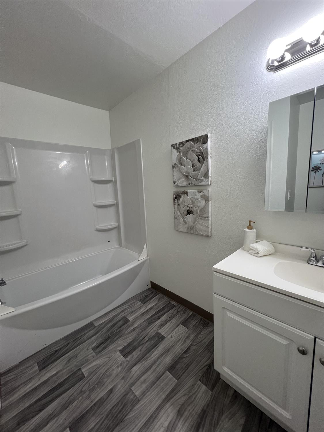 41016 Cornac Terrace Fremont, CA 94539 - Photo 14 of 24 a bathroom with a sink and a mirror