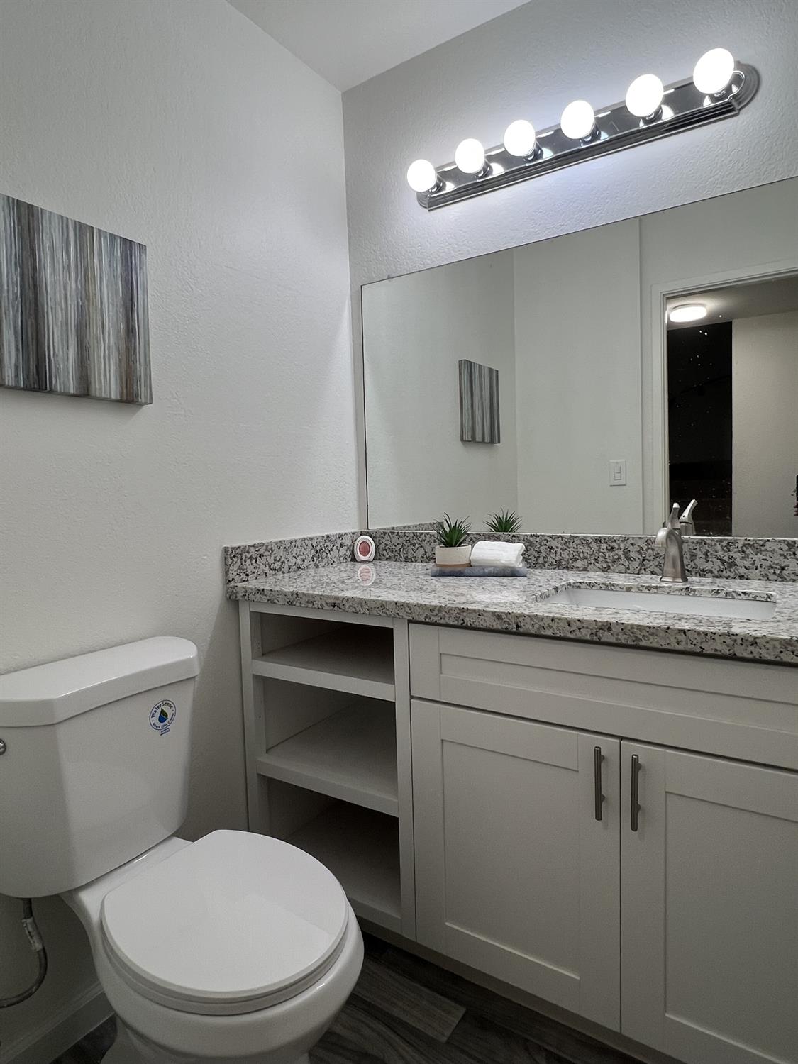 41016 Cornac Terrace Fremont, CA 94539 - Photo 15 of 24 a bathroom with a granite countertop toilet sink and mirror