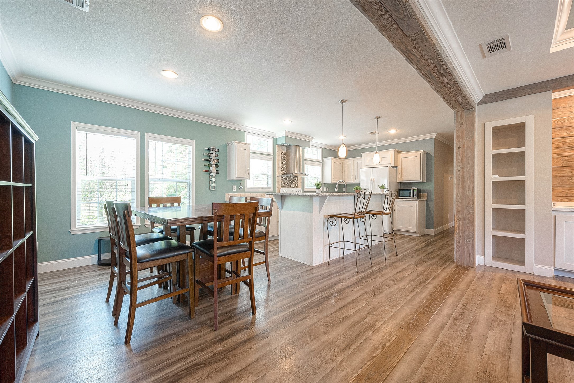 20547 South Post Oak Boulevard, Unit B Fresno, TX 77545 - Photo 11 of 46 a view of a dining room with furniture and wooden floor