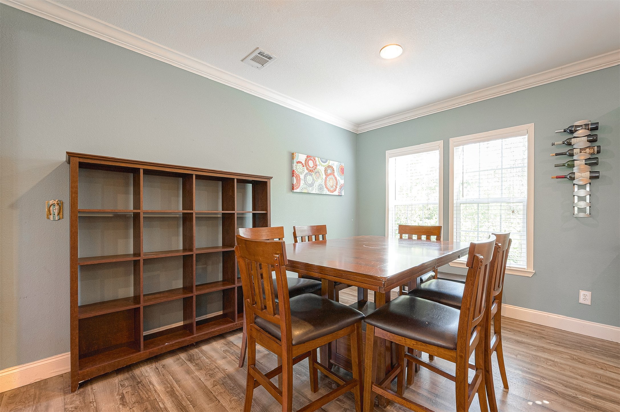 20547 South Post Oak Boulevard, Unit B Fresno, TX 77545 - Photo 16 of 46 a view of a dining room with furniture and a window