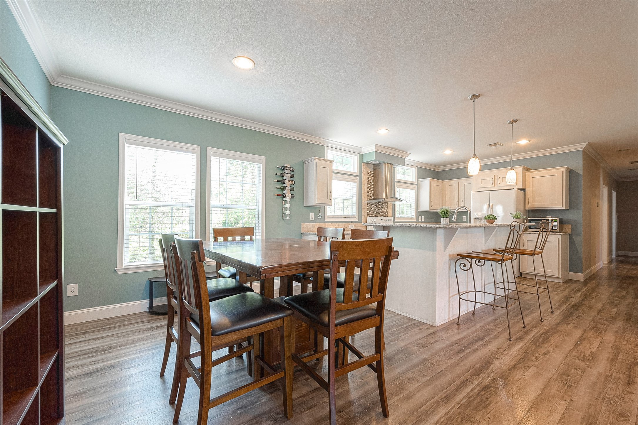 20547 South Post Oak Boulevard, Unit B Fresno, TX 77545 - Photo 17 of 46 a view of a dining room with furniture and wooden floor