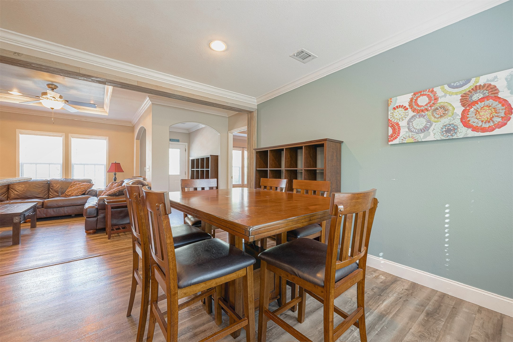 20547 South Post Oak Boulevard, Unit B Fresno, TX 77545 - Photo 18 of 46 a dining room with furniture and wooden floor