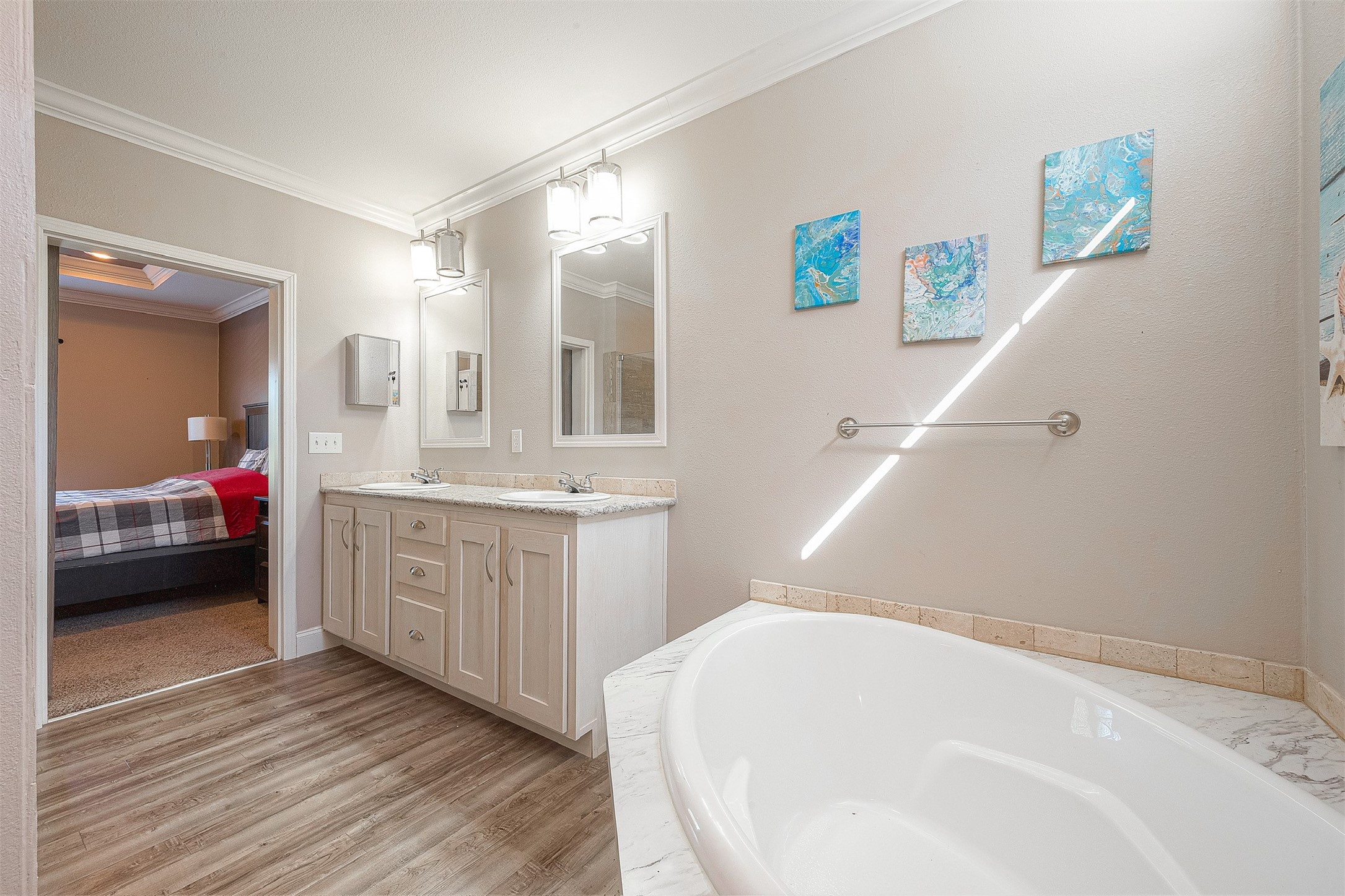 20547 South Post Oak Boulevard, Unit B Fresno, TX 77545 - Photo 45 of 46 a en suite bathroom with a double vanity sink and a mirror
