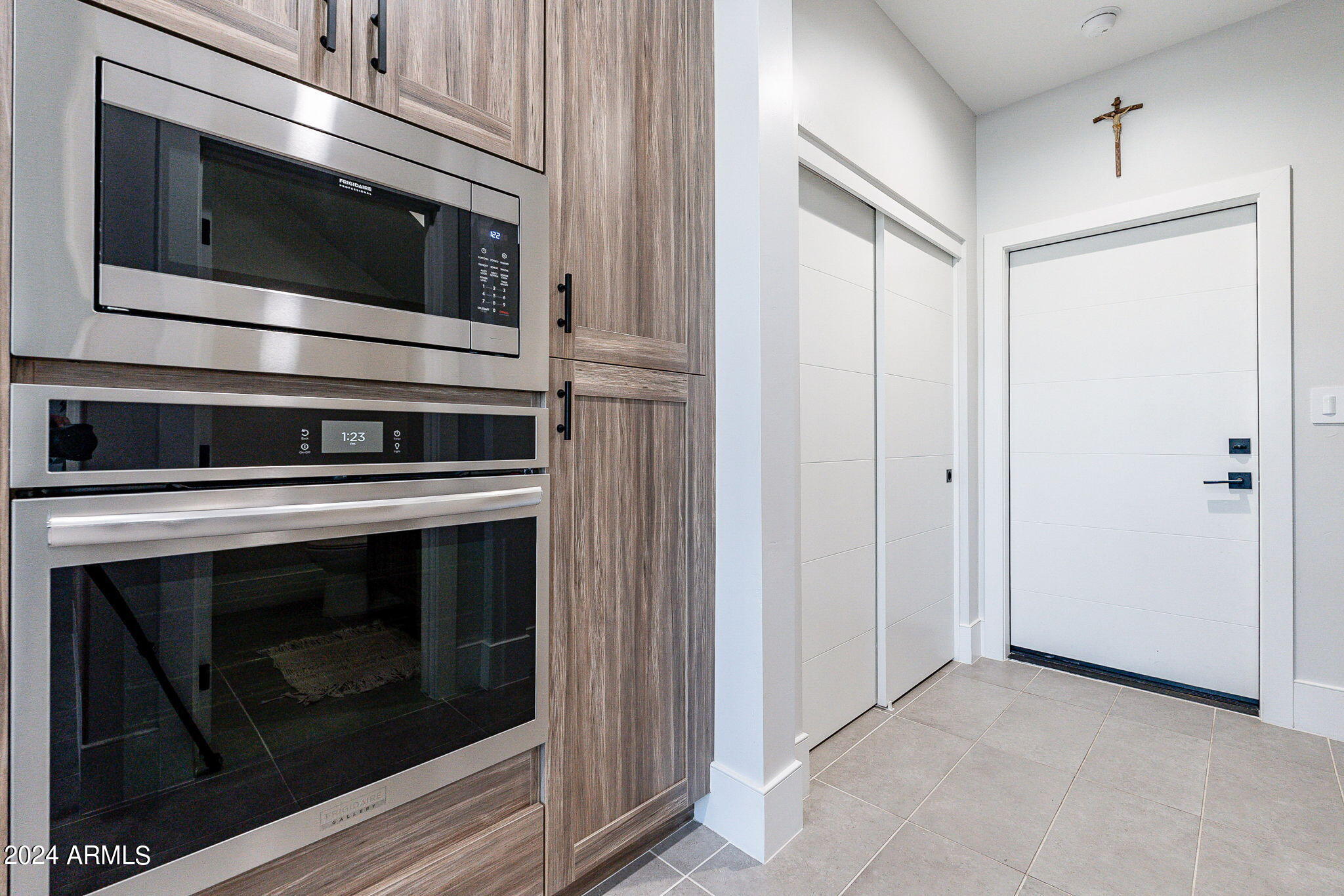 142 East Hearne Way Gilbert, AZ 85234 - Photo 13 of 44 a kitchen with cabinets and stainless steel appliances